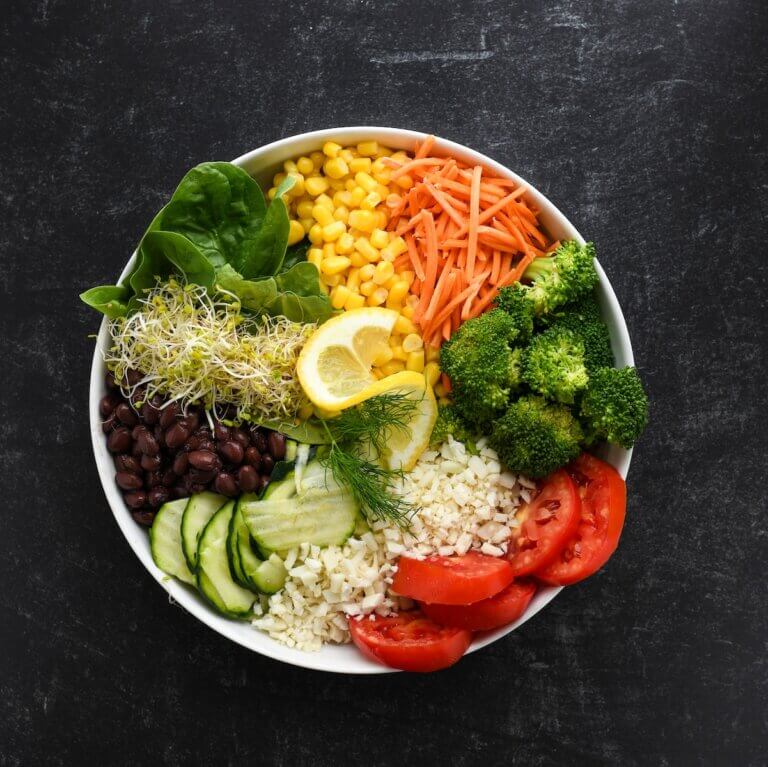Healthy Colorful Veggies and Rice, in White Bowl, Black Background